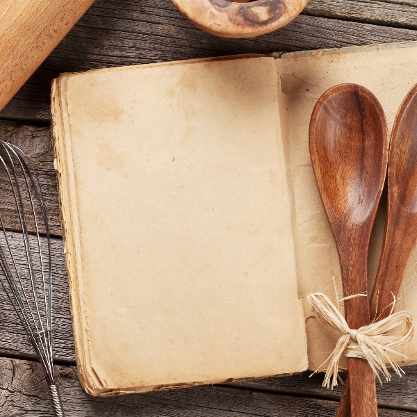 Blank vintage recipe cooking book and utensils